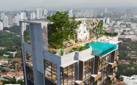 29 - Panama Elite Homes Modern glass-and-concrete apartment building with a rooftop pool, greenery, and a city skyline in the background.