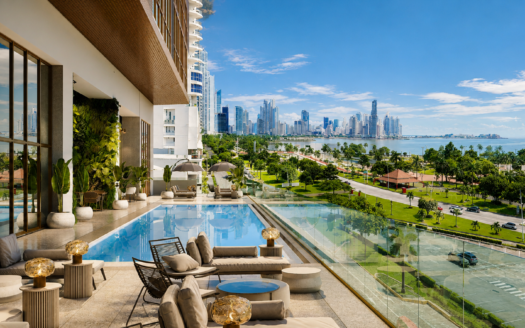 2 - Panama Elite Homes Luxurious outdoor pool terrace overlooking a city skyline and bay, with lounge chairs and glass barrier.