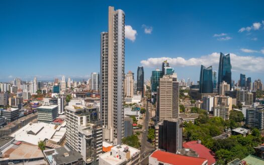 91568072-3933-42ec-883a-8d61d004b098 - Panama Elite Homes Panoramic city skyline with numerous high-rise buildings under a clear blue sky during daytime